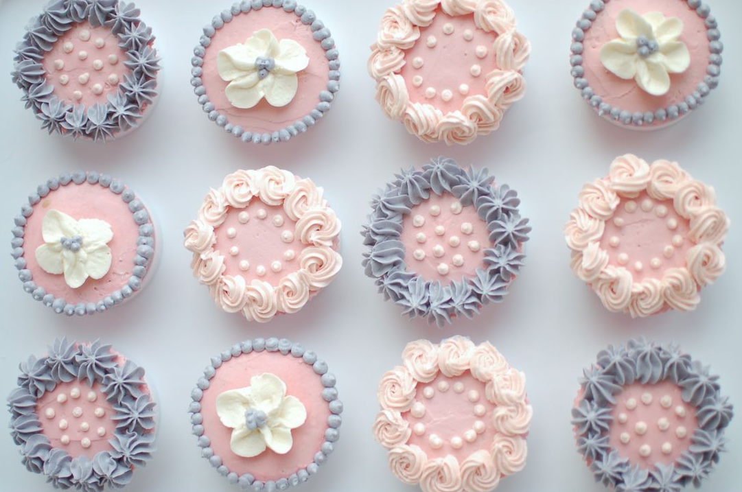 decoarted cupcakes organized in a grid