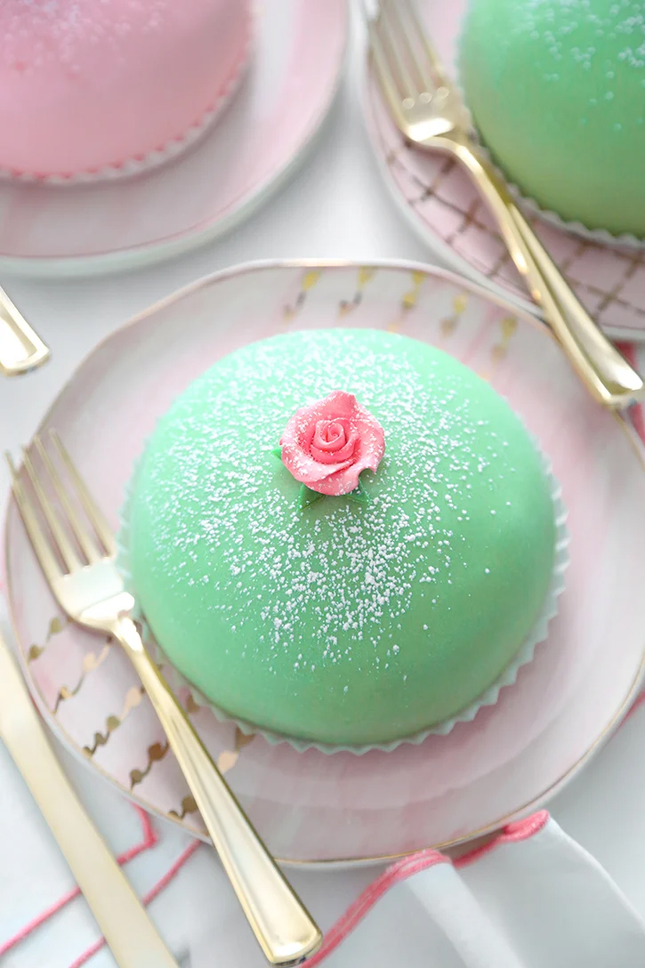 small, green and round cake on a plate 